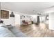 Large living area with luxury vinyl plank, white walls, lots of natural light, and simple decorations at 11245 Sw 63Rd Terrace Rd, Ocala, FL 34476