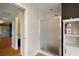 Bathroom features a walk-in shower with glass doors at 13786 Se 88Th Ct, Summerfield, FL 34491