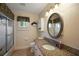Bathroom featuring a vanity with granite countertops and a shower/tub combo at 13786 Se 88Th Ct, Summerfield, FL 34491