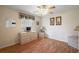 Bedroom featuring laminate wood flooring and plenty of natural light at 13786 Se 88Th Ct, Summerfield, FL 34491