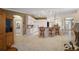 Open kitchen boasts a large island with seating, white cabinets, and modern appliances at 13786 Se 88Th Ct, Summerfield, FL 34491