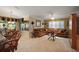 Spacious living room features neutral paint, large windows and a plush sectional sofa at 13786 Se 88Th Ct, Summerfield, FL 34491