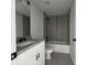 Bathroom featuring granite counters, white cabinetry, and a tiled shower/tub at 15419 Sw 65Th Terrace Rd, Ocala, FL 34473