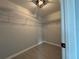 Walk-in closet with ample shelving, providing organized storage space at 15419 Sw 65Th Terrace Rd, Ocala, FL 34473