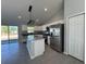 Open kitchen featuring stainless steel appliances and a large island at 15419 Sw 65Th Terrace Rd, Ocala, FL 34473