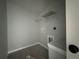 Laundry room featuring gray flooring, white walls, and built in shelving at 15419 Sw 65Th Terrace Rd, Ocala, FL 34473