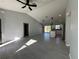 Spacious living room with tile flooring and modern ceiling fan at 15419 Sw 65Th Terrace Rd, Ocala, FL 34473