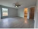 Spacious main bedroom featuring tile floors, a ceiling fan, and natural light at 15419 Sw 65Th Terrace Rd, Ocala, FL 34473