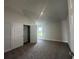 Bright bedroom featuring neutral walls, vaulted ceilings, carpet, a closet and a view to the yard at 15833 Se 97Th Ter, Summerfield, FL 34491