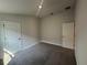 Spacious bedroom featuring neutral paint, carpet flooring, and modern doors at 15833 Se 97Th Ter, Summerfield, FL 34491