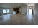 Open-concept living area featuring tiled floors, recessed lighting, and seamless flow to the kitchen at 15833 Se 97Th Ter, Summerfield, FL 34491