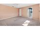 Cozy bedroom with carpet floors and ensuite bathroom with shower at 17915 Se 102Nd Ter, Summerfield, FL 34491