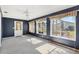 Comfortable sunroom with large windows offering plenty of natural light and access to the lanai at 17915 Se 102Nd Ter, Summerfield, FL 34491