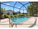 Relaxing pool area with screened enclosure, providing a perfect space for outdoor enjoyment at 17915 Se 102Nd Ter, Summerfield, FL 34491