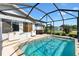 Sparkling pool with screened lanai and hot tub, set in a tranquil backyard setting at 17915 Se 102Nd Ter, Summerfield, FL 34491