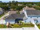 Aerial view of the backyard with a patio, sitting area, swing set, and a well-maintained lawn at 1906 Se 28Th Pl, Ocala, FL 34471
