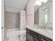 Well-maintained bathroom featuring a shower-tub combination and granite countertop at 1906 Se 28Th Pl, Ocala, FL 34471