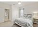 Bright bedroom with carpeted floors, a ceiling fan, and ensuite bathroom access at 1906 Se 28Th Pl, Ocala, FL 34471