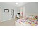 Bright bedroom with a glass desk and ensuite bathroom access featuring bright light at 1906 Se 28Th Pl, Ocala, FL 34471