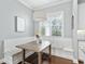 Bright breakfast nook features built-in seating and a charming table with hardwood flooring at 1906 Se 28Th Pl, Ocala, FL 34471