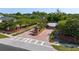 View of the community entrance with brick accents, landscaping, and signage at 1906 Se 28Th Pl, Ocala, FL 34471