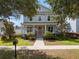 Charming two-story home with a welcoming porch and well-manicured front yard at 1906 Se 28Th Pl, Ocala, FL 34471