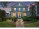 Charming two-story home with a welcoming front porch, landscaped yard, and elegant curb appeal at 1906 Se 28Th Pl, Ocala, FL 34471