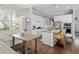 Spacious kitchen with white cabinets, granite countertops, stainless steel appliances, and breakfast nook at 1906 Se 28Th Pl, Ocala, FL 34471