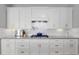 Modern kitchen with white cabinets, stainless steel appliances, and a subway tile backsplash at 1906 Se 28Th Pl, Ocala, FL 34471