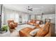 Bright living room with contemporary furnishings and a view of the open kitchen space at 1906 Se 28Th Pl, Ocala, FL 34471