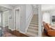 Bright staircase with carpet and white railing leads to the upper level at 1906 Se 28Th Pl, Ocala, FL 34471