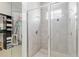 Beautifully tiled walk-in shower, glass surround, and acces to walk-in closet at 1906 Se 28Th Pl, Ocala, FL 34471