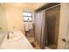 Bathroom with a shower and tub combination with stone flooring and neutral walls at 2406 Se 40Th Street Rd, Ocala, FL 34480