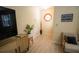Well-lit hallway with wood flooring, stylish accents and a decorative window at 2406 Se 40Th Street Rd, Ocala, FL 34480