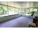 Enclosed lanai with tiled flooring and lots of natural light at 2406 Se 40Th Street Rd, Ocala, FL 34480