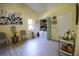 Charming living area with a bar cart, decorative seating, and a curated display of art and plants at 2406 Se 40Th Street Rd, Ocala, FL 34480