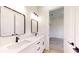 Bathroom features double vanity with quartz countertop and modern fixtures at 2438 Sw 165Th Street Rd, Ocala, FL 34473