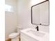 Powder room featuring a modern vanity with a white countertop and black fixtures at 2438 Sw 165Th Street Rd, Ocala, FL 34473