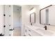 Bathroom with double sinks, and black fixtures, providing a serene and functional space at 2438 Sw 165Th Street Rd, Ocala, FL 34473