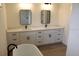 This bathroom features dual sinks, modern lighting, and plenty of storage space for toiletries and essentials at 2438 Sw 165Th Street Rd, Ocala, FL 34473
