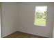 Bright bedroom with a window overlooking a lush green lawn at 2438 Sw 165Th Street Rd, Ocala, FL 34473