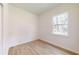 Bright bedroom with hardwood flooring, a window, and neutral walls at 2438 Sw 165Th Street Rd, Ocala, FL 34473