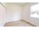 Bright bedroom featuring hardwood flooring, a window, and a closet at 2438 Sw 165Th Street Rd, Ocala, FL 34473