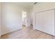 Bedroom featuring hardwood flooring, a closet, and an ensuite bath with double sinks at 2438 Sw 165Th Street Rd, Ocala, FL 34473