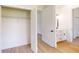 Bedroom boasts an ensuite bathroom and walk-in closet with shelving at 2438 Sw 165Th Street Rd, Ocala, FL 34473