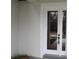 Close-up on the entryway showcasing a glass door and a clean, modern aesthetic at 2438 Sw 165Th Street Rd, Ocala, FL 34473