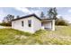 Charming home with a covered patio, white exterior, and ample natural light from the windows at 2438 Sw 165Th Street Rd, Ocala, FL 34473
