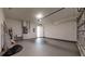 A spacious two car garage features painted walls, sealed concrete flooring and utility sink at 2438 Sw 165Th Street Rd, Ocala, FL 34473