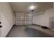 Spacious garage with modern door, ample storage space, and epoxy floor at 2438 Sw 165Th Street Rd, Ocala, FL 34473