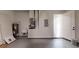 Clean and organized garage featuring a water heater and other utilities at 2438 Sw 165Th Street Rd, Ocala, FL 34473